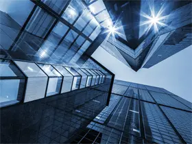 Blue-tinted buildings reaching skyward