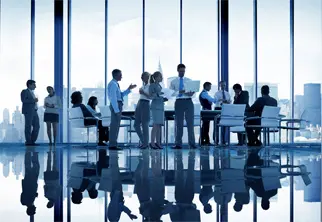 Team discussion with city view backdrop