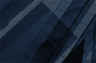 Glass building facade with geometric patterns