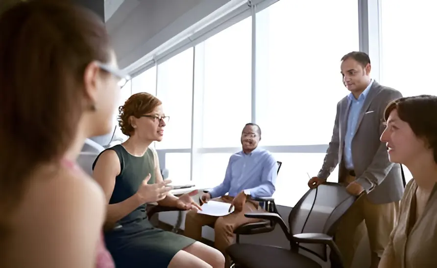 Team brainstorming session by window