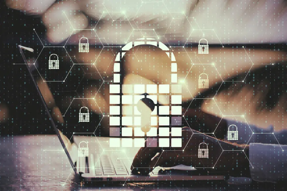 Laptop user with security icons overlay