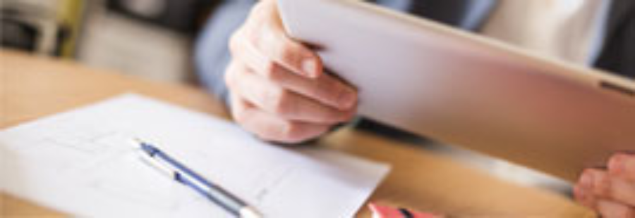 Person using tablet at desk